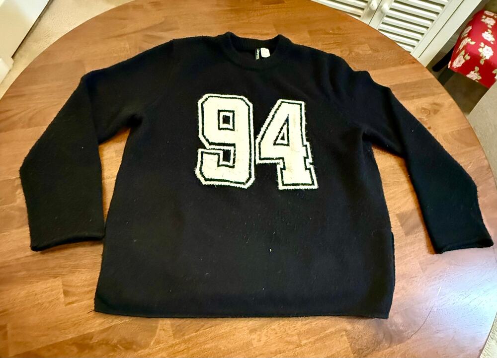 Vintage H&M Divided black sweatshirt with the number 94.